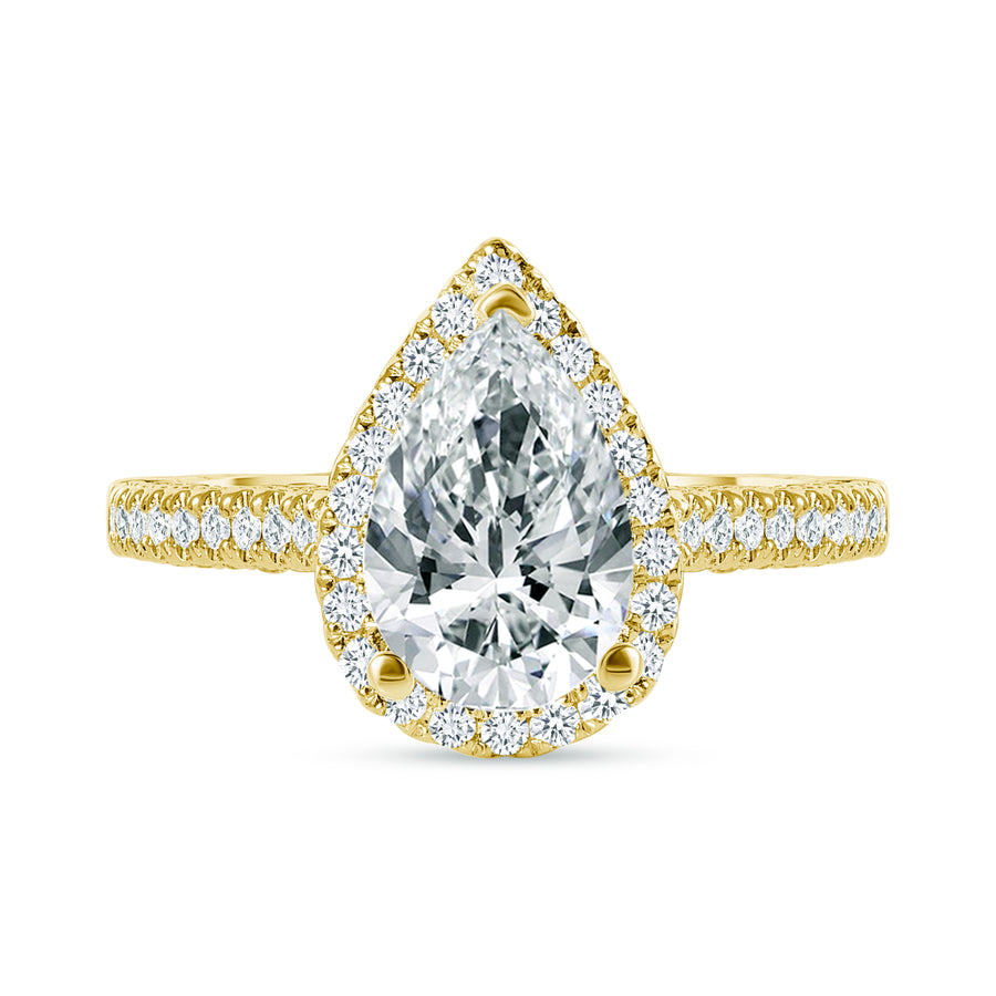 large pear shaped & small round diamond engagement ring yellow gold